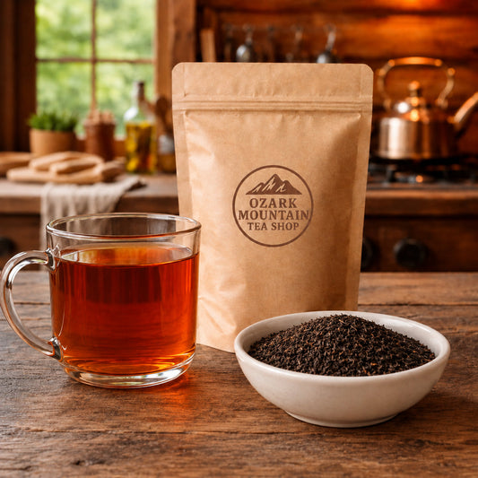 Black Bear Pekoe brewed tea, loose tea ingredients, and Ozark Mountain Tea Shop brown packaging