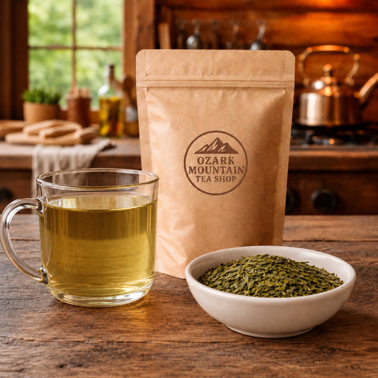 Dragonwell Green Tea ~ Longjing brewed tea, loose tea ingredients, and Ozark Mountain Tea Shop brown packaging