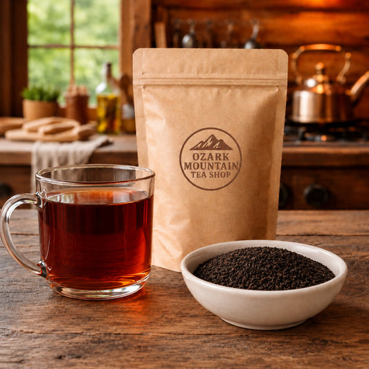English Breakfast brewed tea, loose tea ingredients, and Ozark Mountain Tea Shop brown packaging