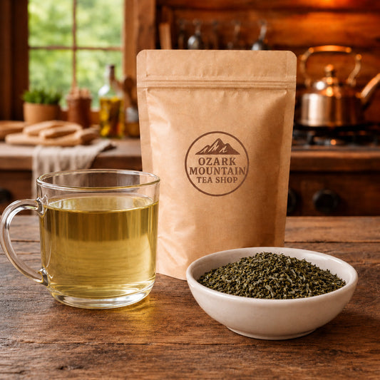 Ghost Cat Green brewed tea, loose green tea leaves, and Ozark Mountain Tea Shop brown packaging