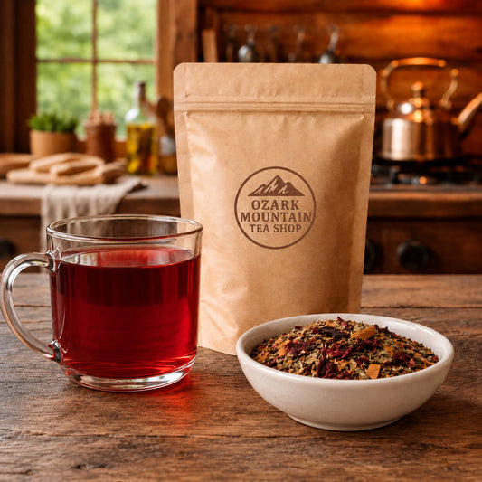 Herbal Cider brewed tea, loose tea ingredients, and Ozark Mountain Tea Shop brown packaging