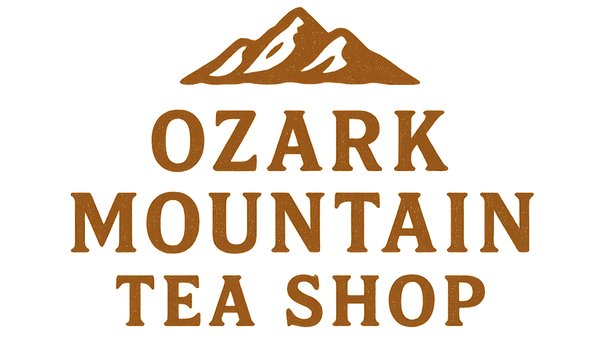 Logo of Ozark Mountain Tea Shop with mountain illustration on a white background