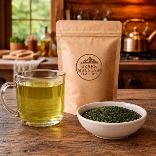 Sencha Green Tea brewed tea, loose tea ingredients, and Ozark Mountain Tea Shop brown packaging