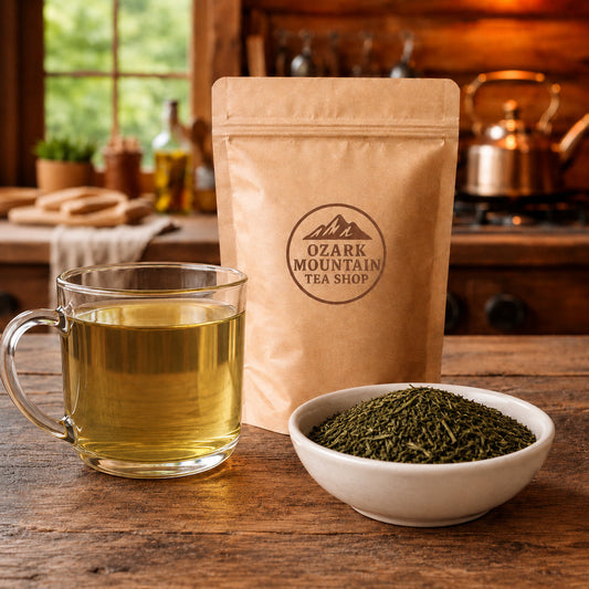 Whispering Bloom brewed tea, loose tea ingredients, and Ozark Mountain Tea Shop brown packaging