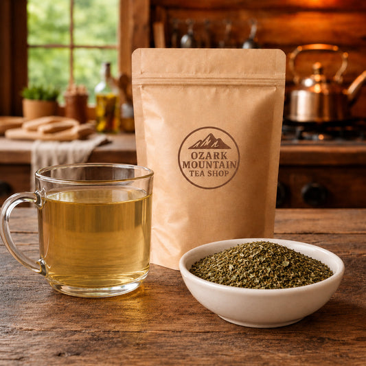 Wild Mint brewed tea, loose tea ingredients, and Ozark Mountain Tea Shop brown packaging